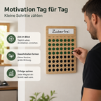 Mann markiert Fortschritt auf magnetischem Holz-Habit-Tracker für tägliche Gewohnheiten