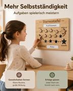Kind setzt einen Stern auf eine Sternentafel aus Holz und sammelt Punkte für erledigte Aufgaben