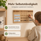 Kind setzt einen Stern auf eine Wochenroutine-Sternentafel aus Holz und verfolgt erledigte Aufgaben